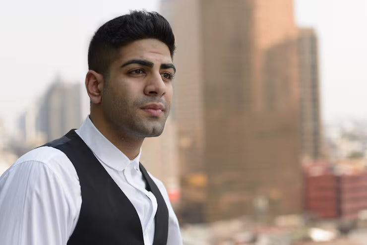 files/portrait-young-handsome-indian-businessman-against-view-city_251136-65251.avif